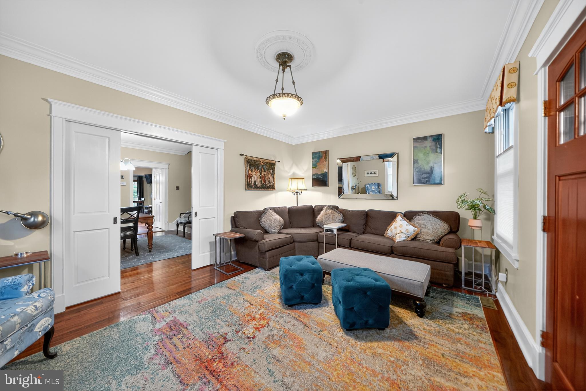 526 East Main Street Moorestown, NJ 08057 - Photo 7 of 49 a living room with furniture a chandelier and a wooden floor