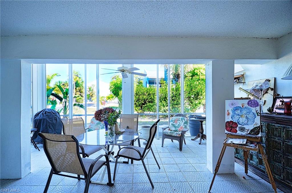 14 Watercolor Way, Unit 14 Naples, FL 34113 - Photo 14 of 28 a view of a dining room with furniture window and outside view