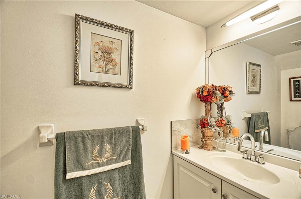 14 Watercolor Way, Unit 14 Naples, FL 34113 - Photo 15 of 28 a bathroom with a sink and a mirror