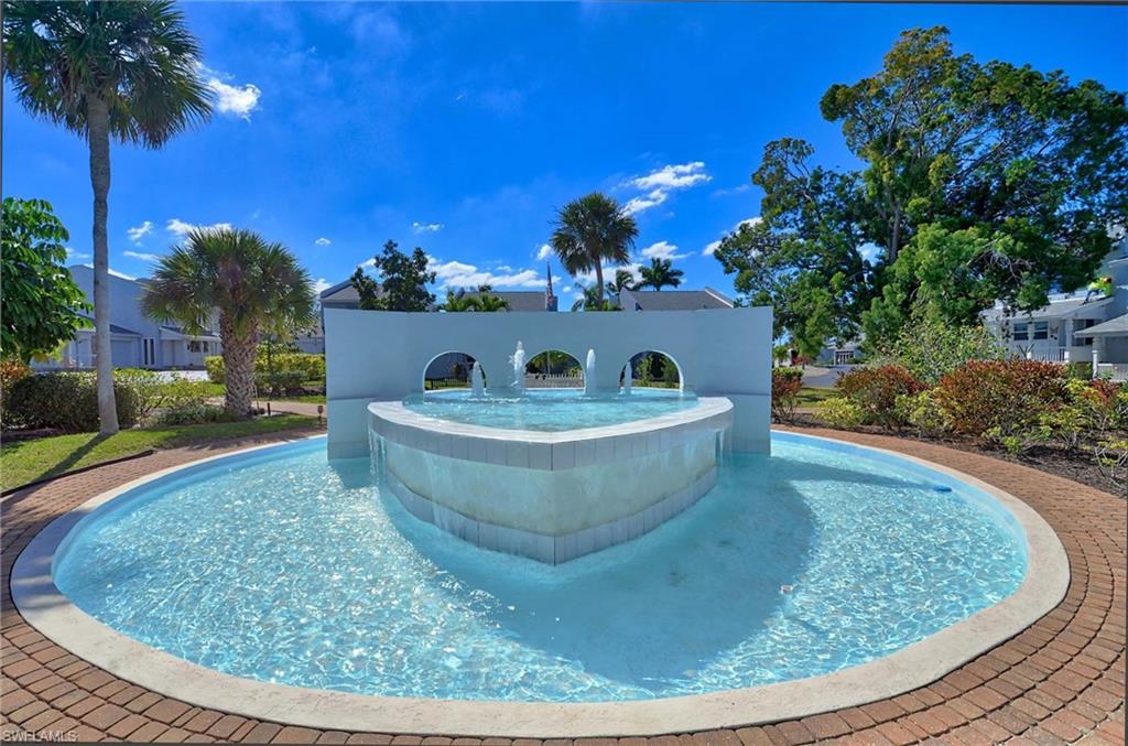 14 Watercolor Way, Unit 14 Naples, FL 34113 - Photo 25 of 28 a view of a fountain in the backyard of a house