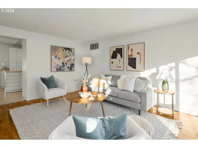 a living room with furniture and a rug