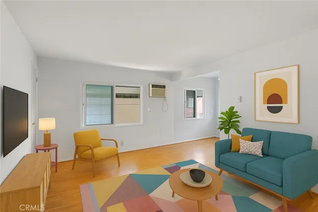 a living room with furniture and a rug