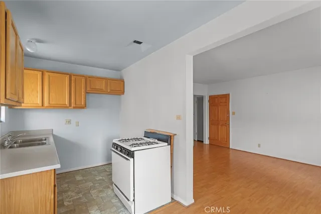 a utility room with sink dryer and washer