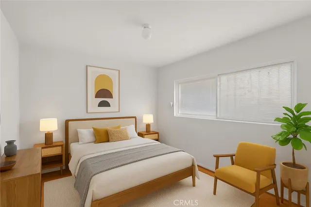 a bedroom with a bed and chair