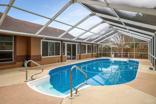 a view of a house with swimming pool