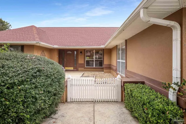a front view of a house with a garage