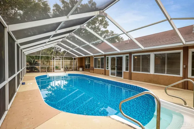 a view of a swimming pool with a lounge chairs
