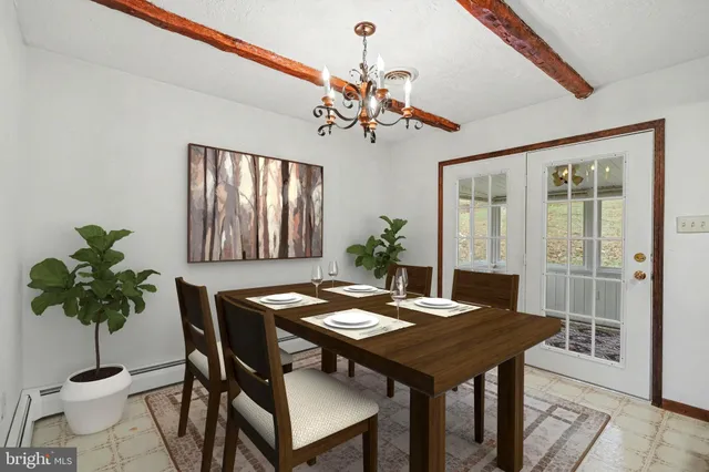 a view of a room with a ceiling fan and window