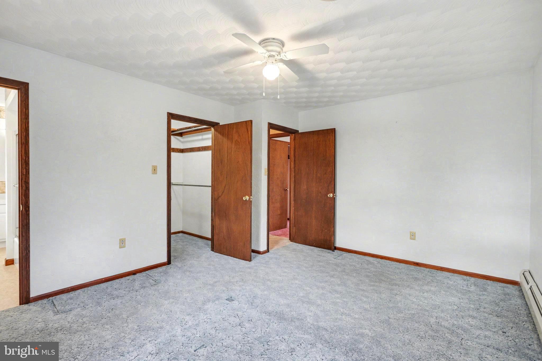 5680 Crone Road Dover, PA 17315 - Photo 21 of 47 an empty room with closet and a ceiling fan