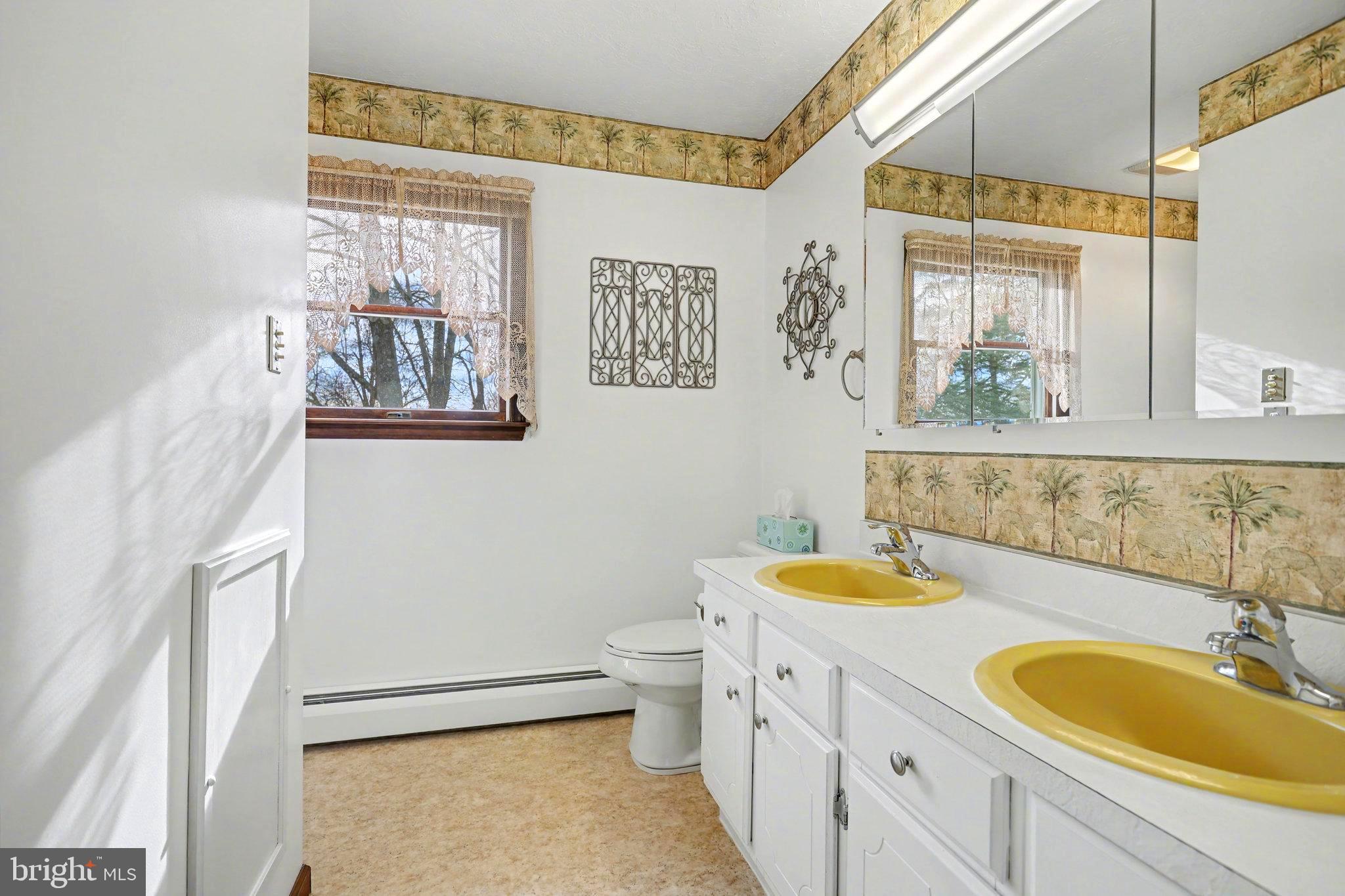 5680 Crone Road Dover, PA 17315 - Photo 27 of 47 a bathroom with a granite countertop sink mirror vanity and a toilet