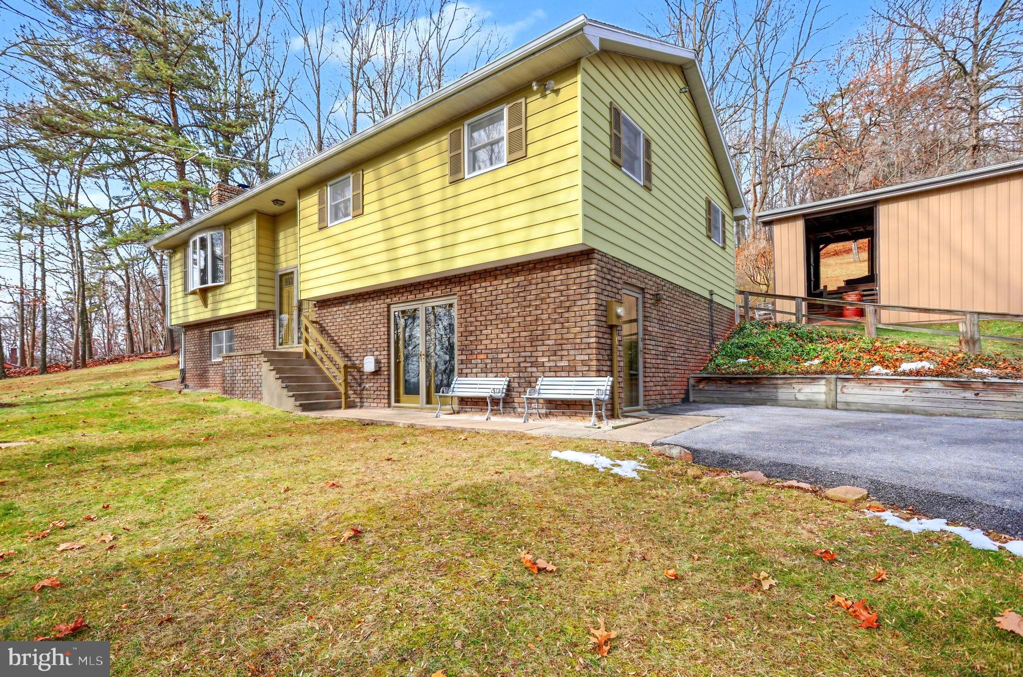 5680 Crone Road Dover, PA 17315 - Photo 3 of 47 a front view of a house with a yard