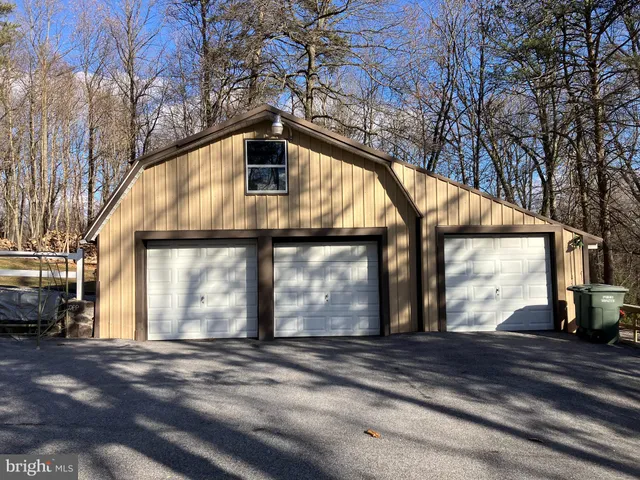 a view of house with outdoor space and sitting area