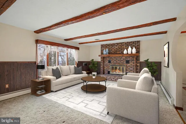 a view of an empty room with a fireplace and a window