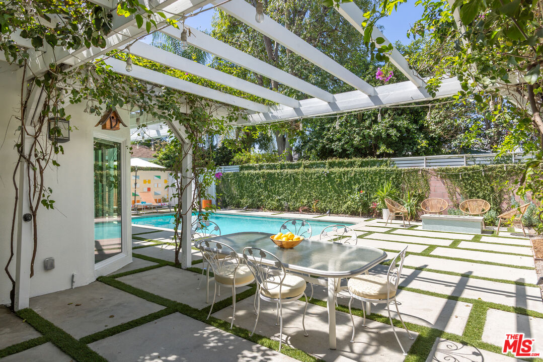 5719 Rhodes Avenue Valley Village, CA 91607 - Photo 23 of 55 a view of a swimming pool with a patio and a yard