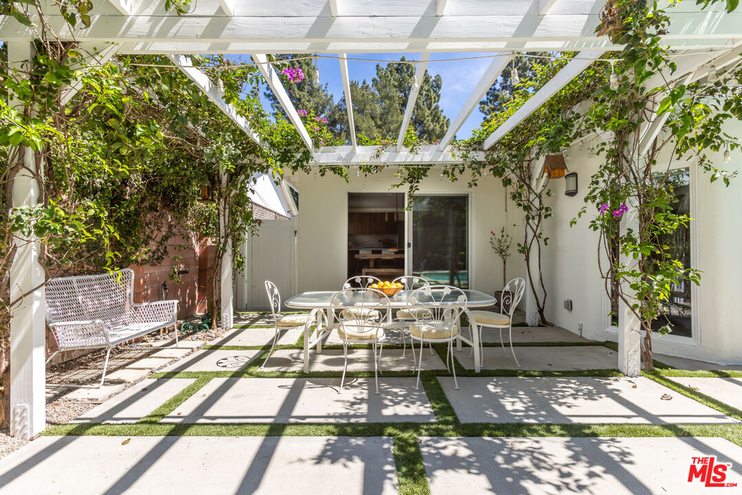 5719 Rhodes Avenue Valley Village, CA 91607 - Photo 24 of 55 a view of a patio with table and chairs and potted plants