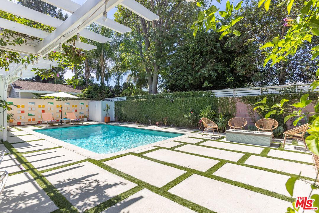 5719 Rhodes Avenue Valley Village, CA 91607 - Photo 25 of 55 a view of a swimming pool with a patio