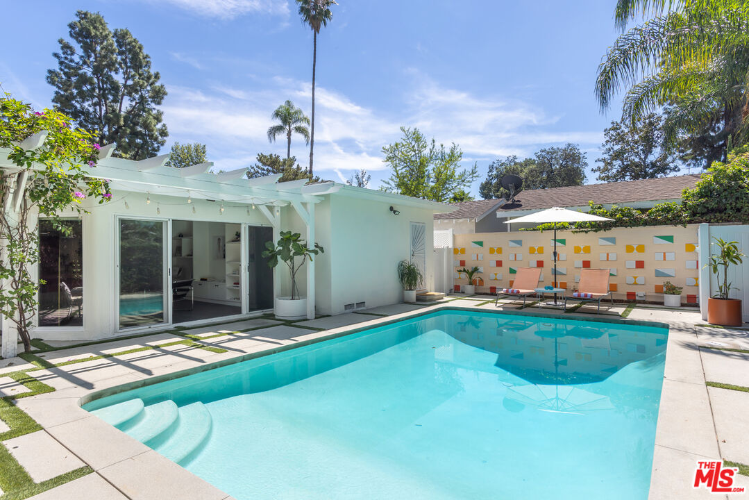 5719 Rhodes Avenue Valley Village, CA 91607 - Photo 27 of 55 a view of a house with swimming pool and a yard