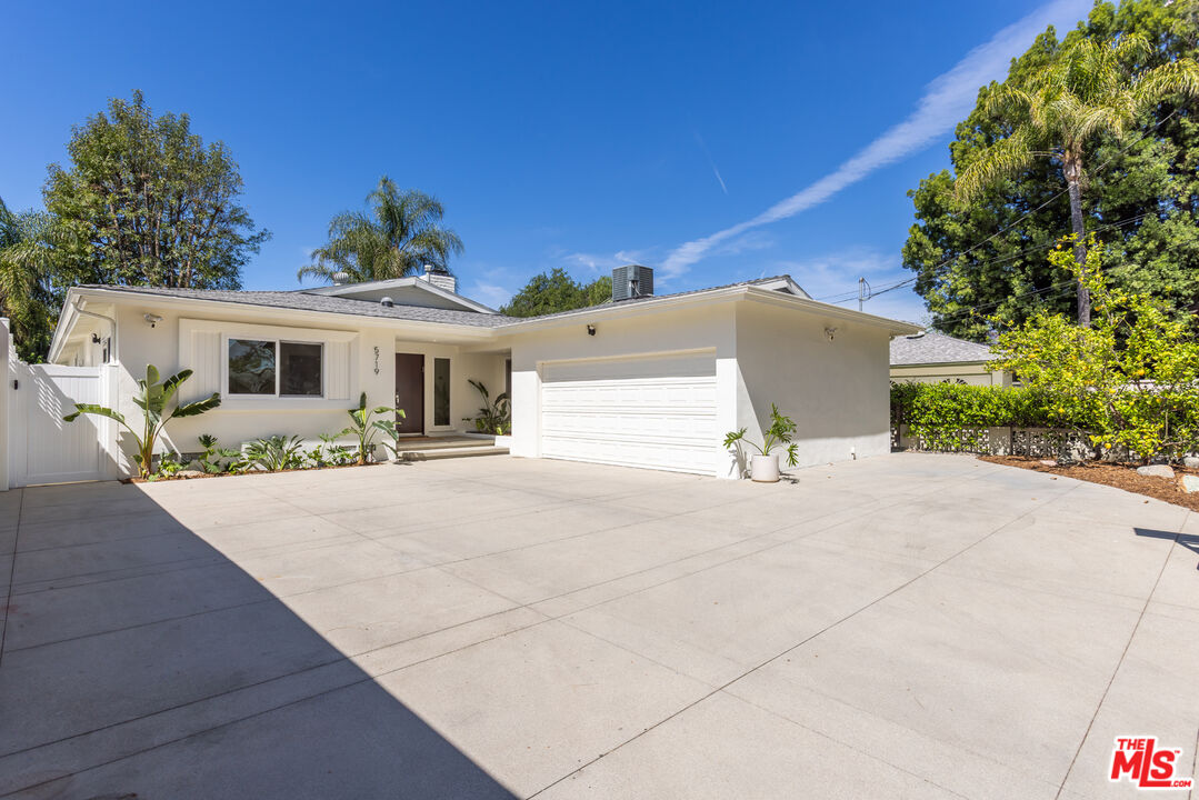 5719 Rhodes Avenue Valley Village, CA 91607 - Photo 3 of 55 front view of a house with potted plants