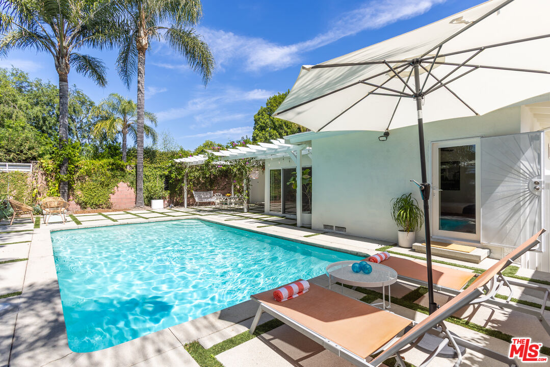 5719 Rhodes Avenue Valley Village, CA 91607 - Photo 31 of 55 a view of a house with backyard and sitting area