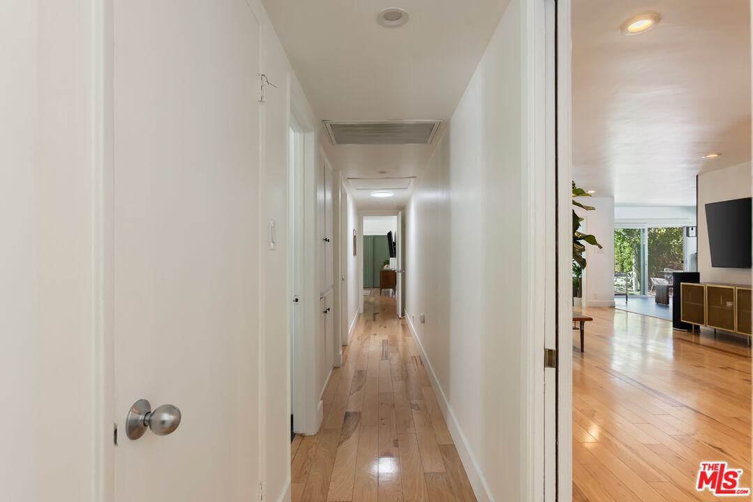 5719 Rhodes Avenue Valley Village, CA 91607 - Photo 33 of 55 a view of a hallway with wooden floor windows and livingroom