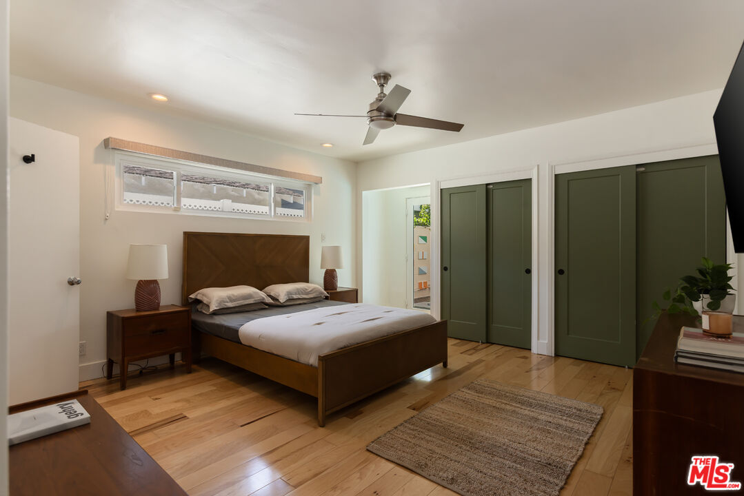 5719 Rhodes Avenue Valley Village, CA 91607 - Photo 35 of 55 a bedroom with a bed wooden floor and window