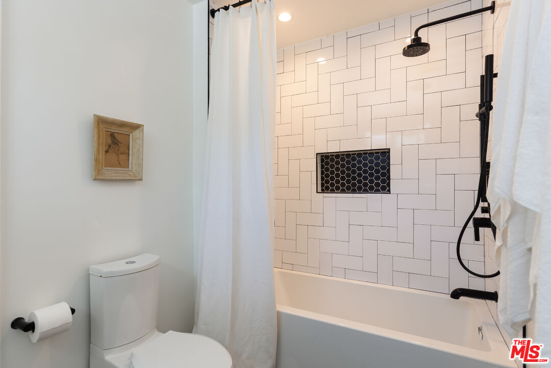 5719 Rhodes Avenue Valley Village, CA 91607 - Photo 38 of 55 a bathroom with a toilet and a shower