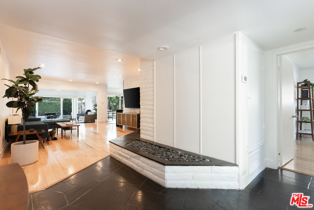 5719 Rhodes Avenue Valley Village, CA 91607 - Photo 44 of 55 a living room with furniture rug and wooden floor