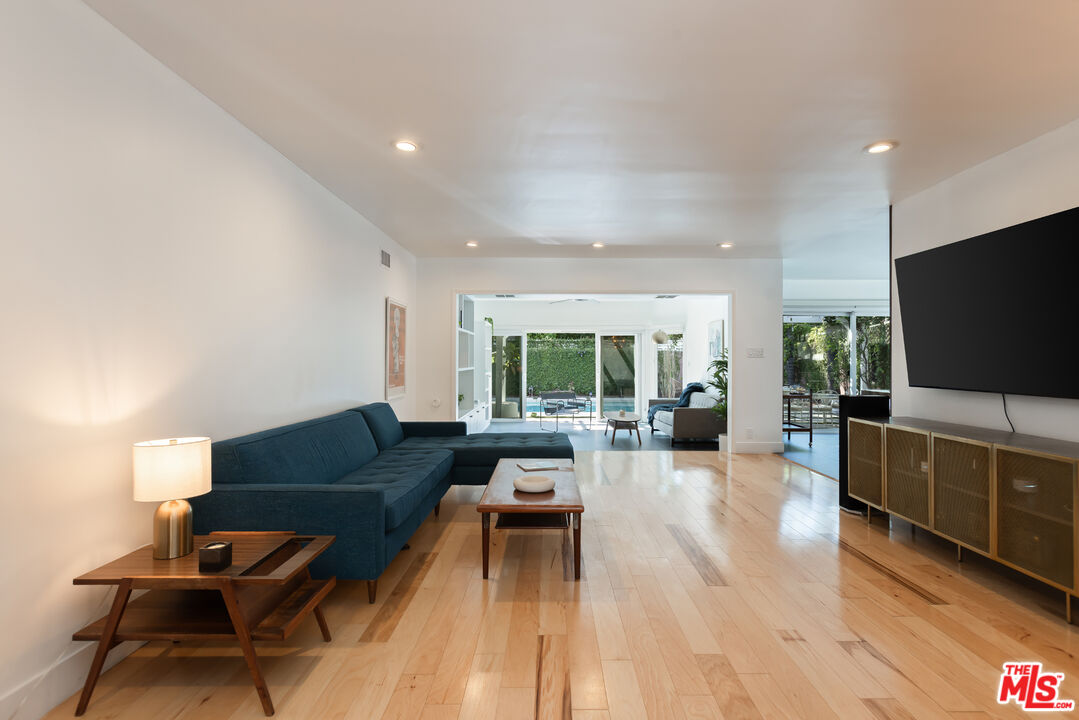 5719 Rhodes Avenue Valley Village, CA 91607 - Photo 8 of 55 a living room with furniture and a flat screen tv