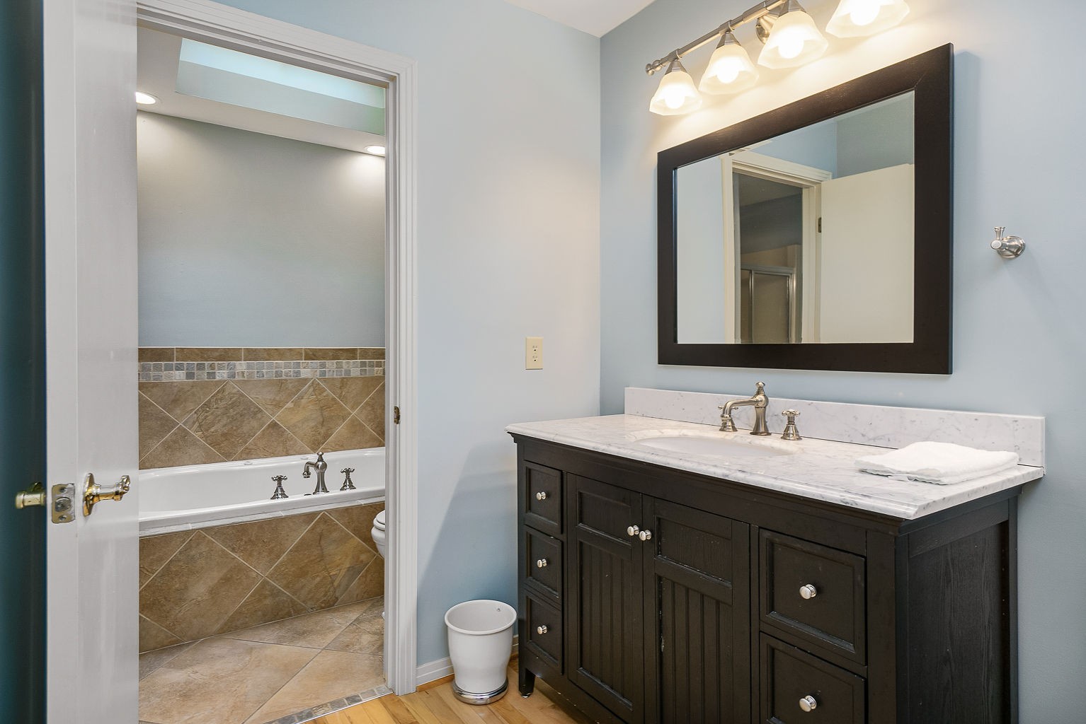 969 Black Berry Hill Road Silver Point, TN 38582 - Photo 17 of 46 a bathroom with a toilet sink and mirror