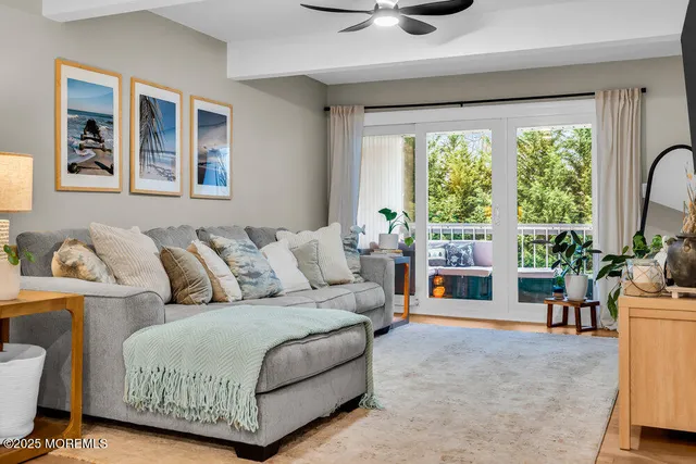 a view of cabinets a wooden floor and a window in the room