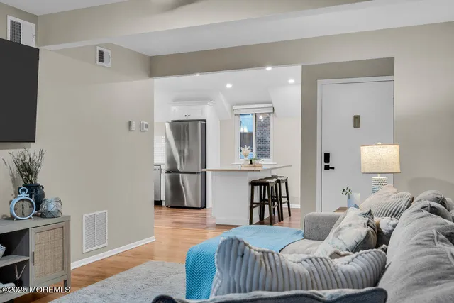 a kitchen with stainless steel appliances a refrigerator sink and cabinets