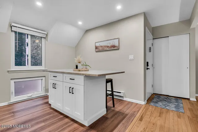 a kitchen with stainless steel appliances granite countertop a sink and a stove