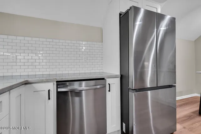 a bedroom with a large bed and a ceiling fan