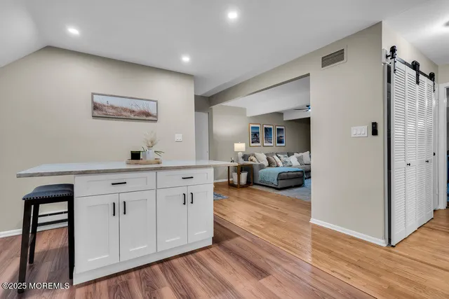 a balcony with furniture and a potted plant