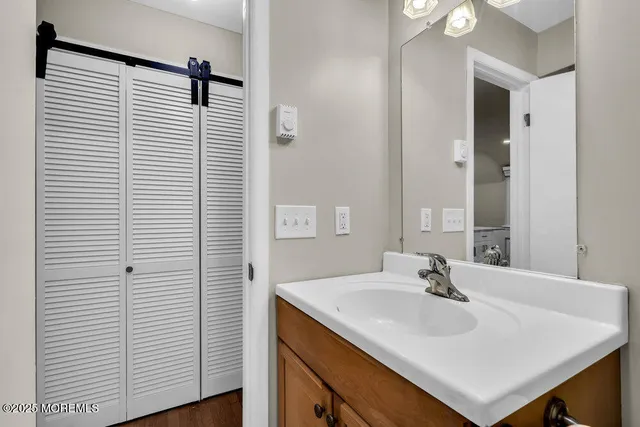 a view of a house with a big yard and a large tree