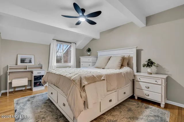 a view of a lake with houses in background