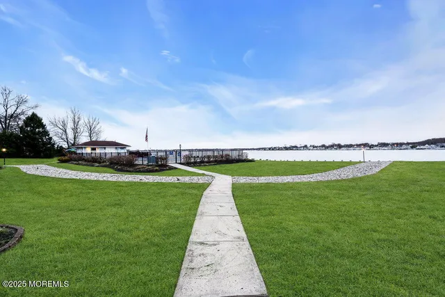 a view of a swimming pool with a yard