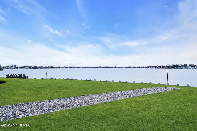 a view of a swimming pool with a garden in the background