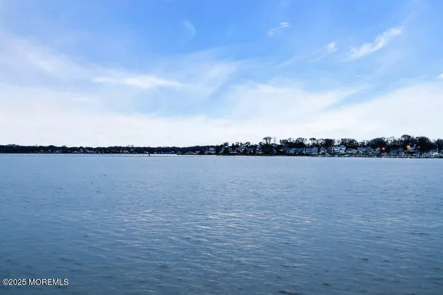 an aerial view of a house with outdoor space
