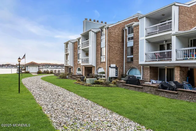 a view of a balcony with wooden floor and iron stairs