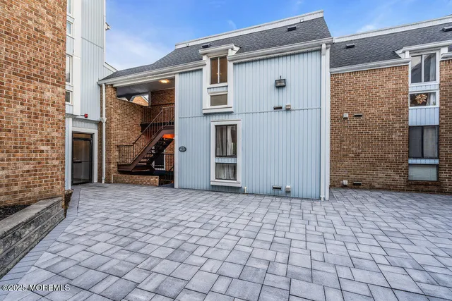 a living room with furniture large window and flat screen tv