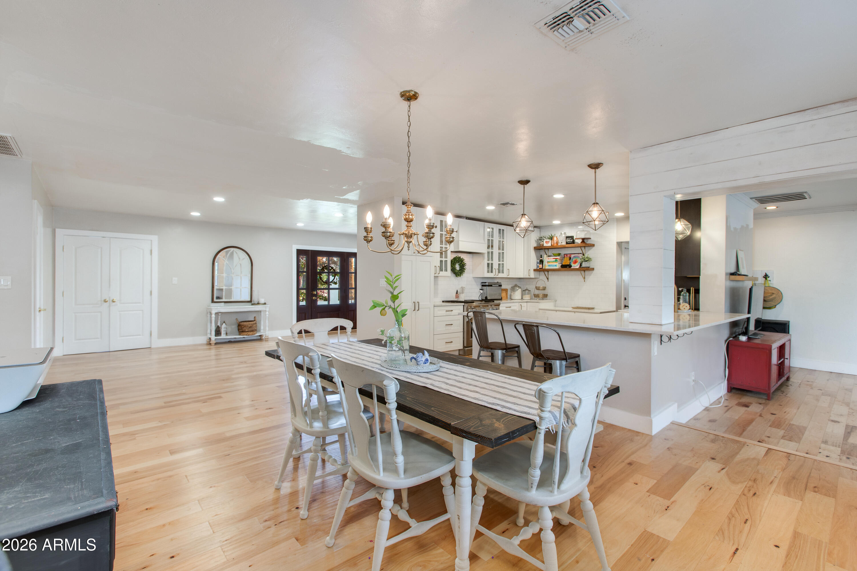 7830 North 7th Avenue Phoenix, AZ 85021 - Photo 11 of 43 a large kitchen with a table and chairs