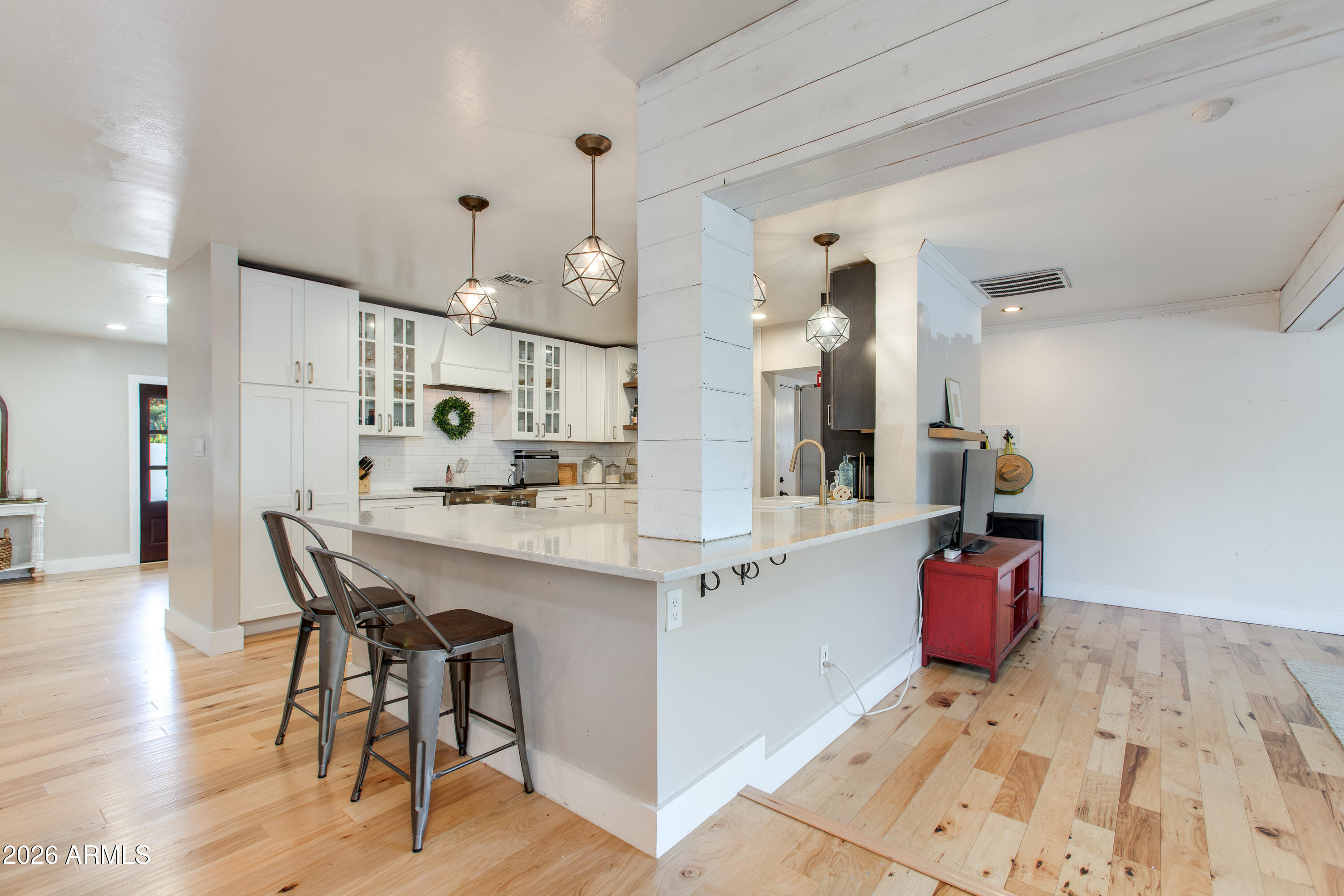7830 North 7th Avenue Phoenix, AZ 85021 - Photo 12 of 43 a kitchen with stainless steel appliances kitchen island granite countertop a sink and cabinets