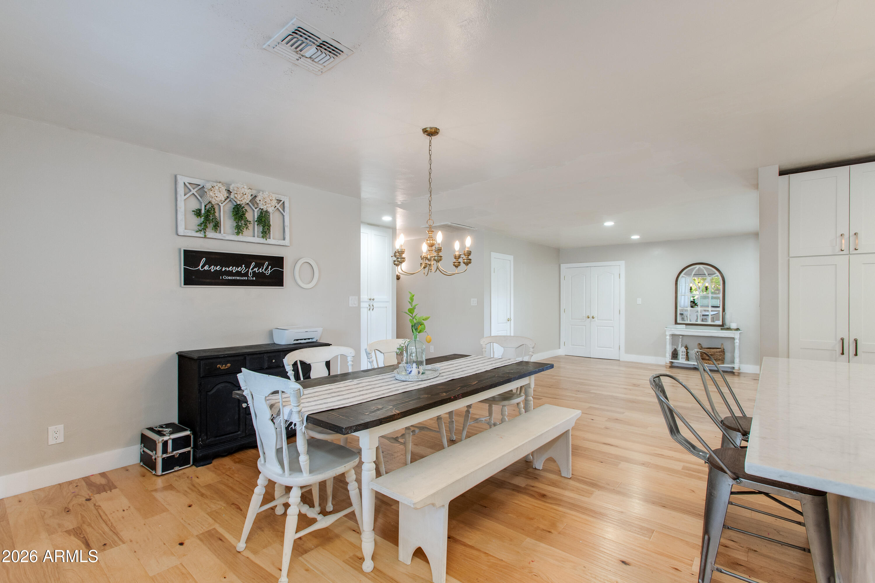 7830 North 7th Avenue Phoenix, AZ 85021 - Photo 13 of 43 a living room with furniture and a chandelier
