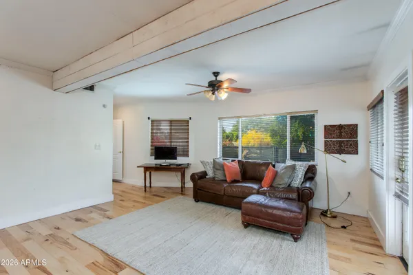 a living room with furniture and a large window