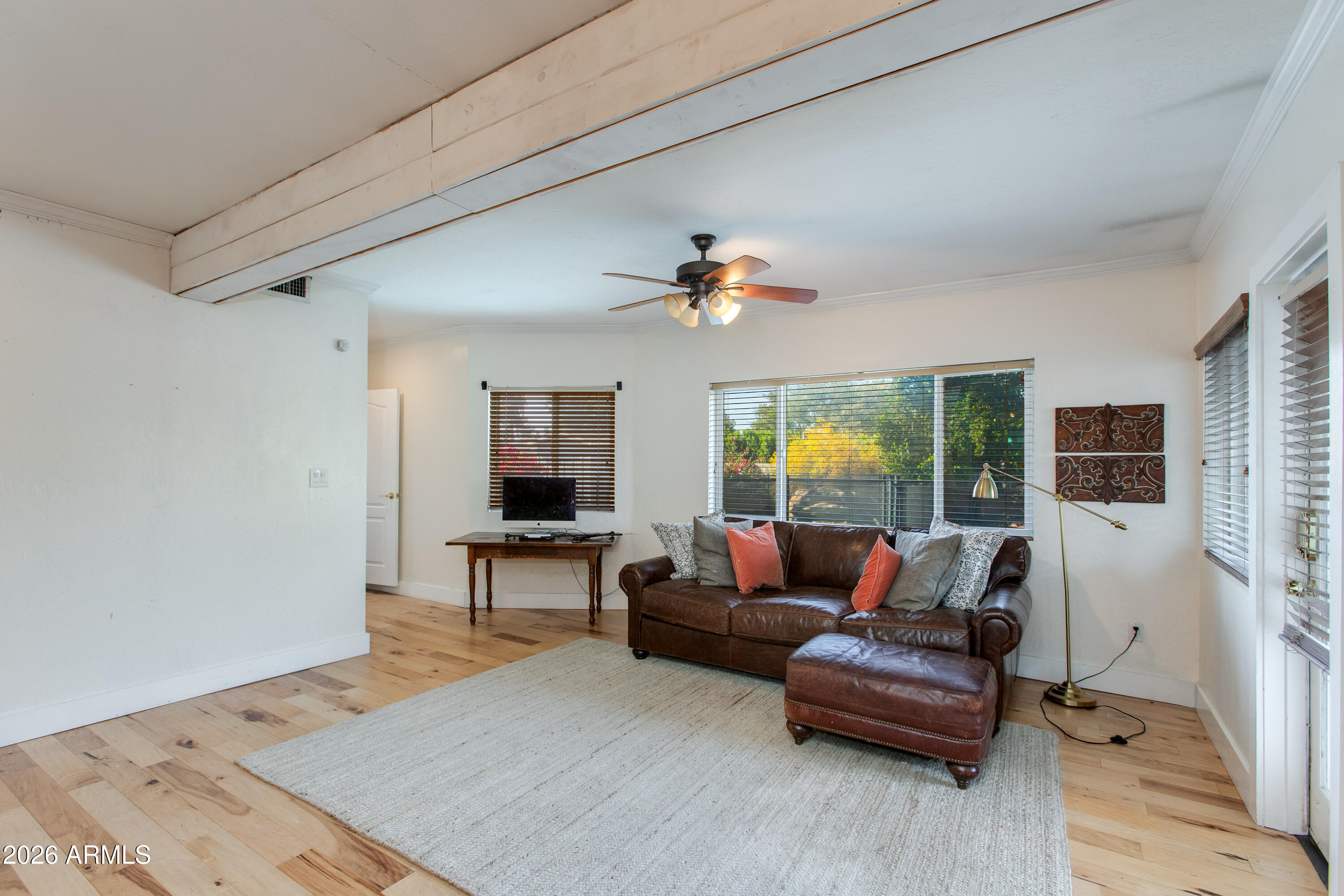 7830 North 7th Avenue Phoenix, AZ 85021 - Photo 14 of 43 a living room with furniture and a flat screen tv