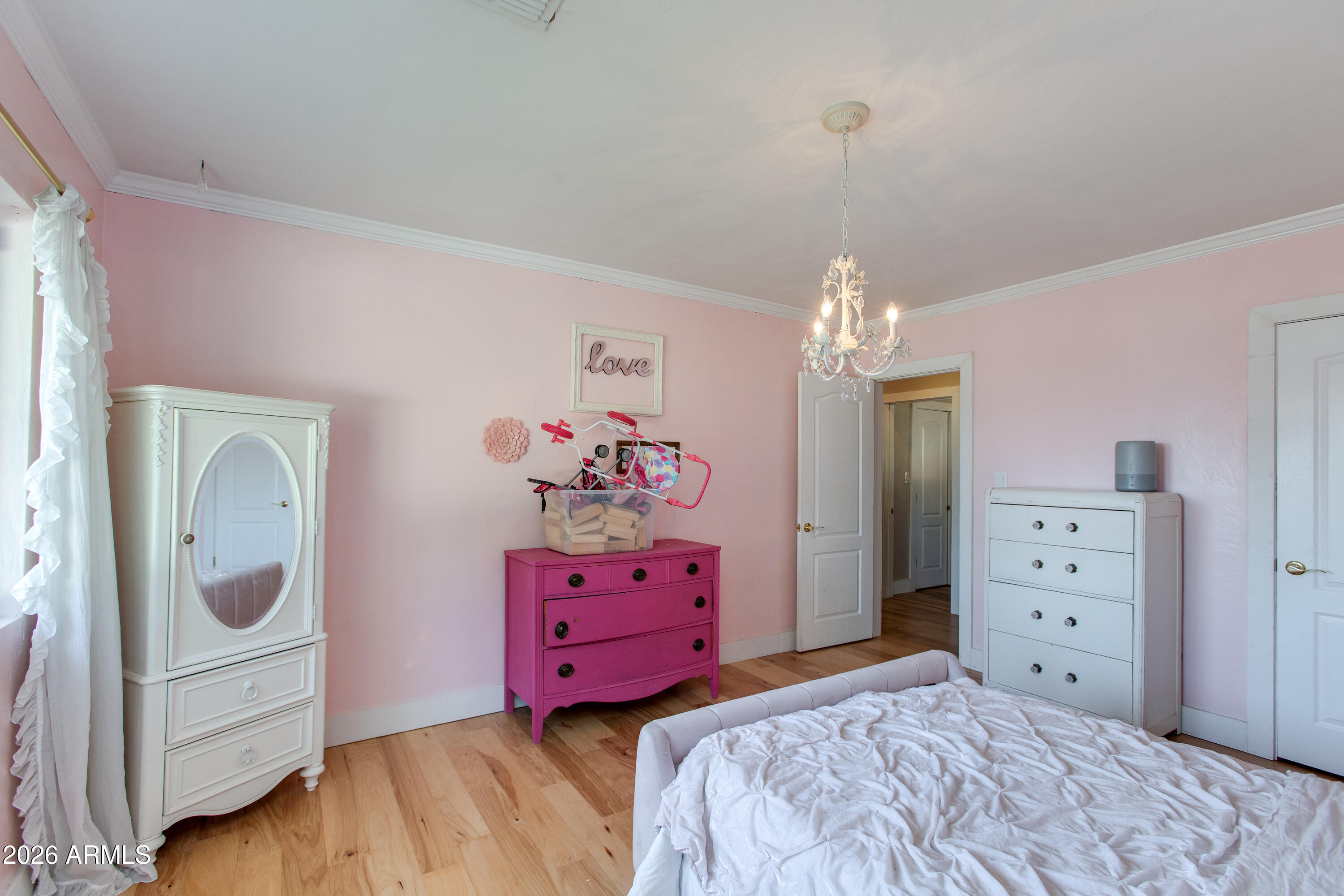 7830 North 7th Avenue Phoenix, AZ 85021 - Photo 22 of 43 a bedroom with a bed dresser and a window