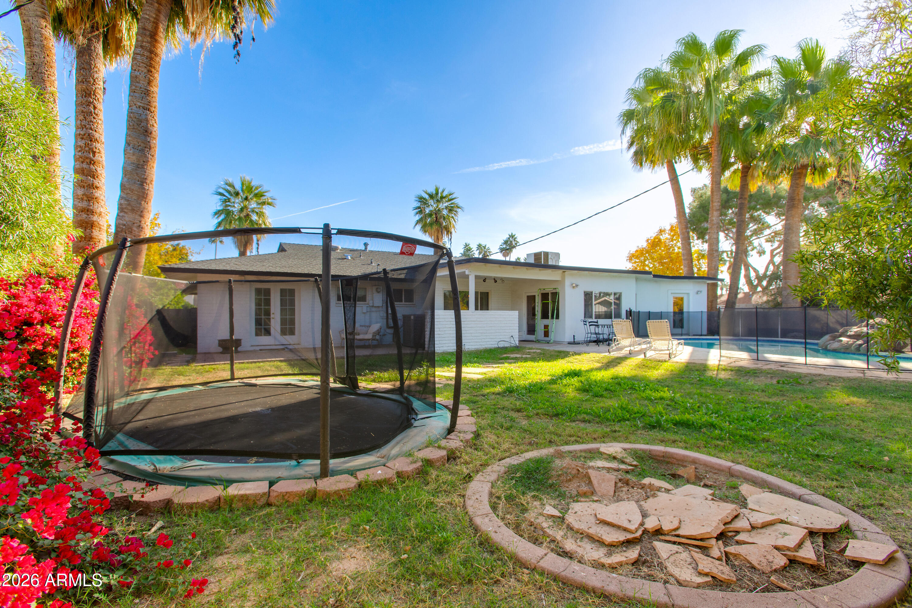 7830 North 7th Avenue Phoenix, AZ 85021 - Photo 29 of 43 a view of a house with backyard and swimming pool