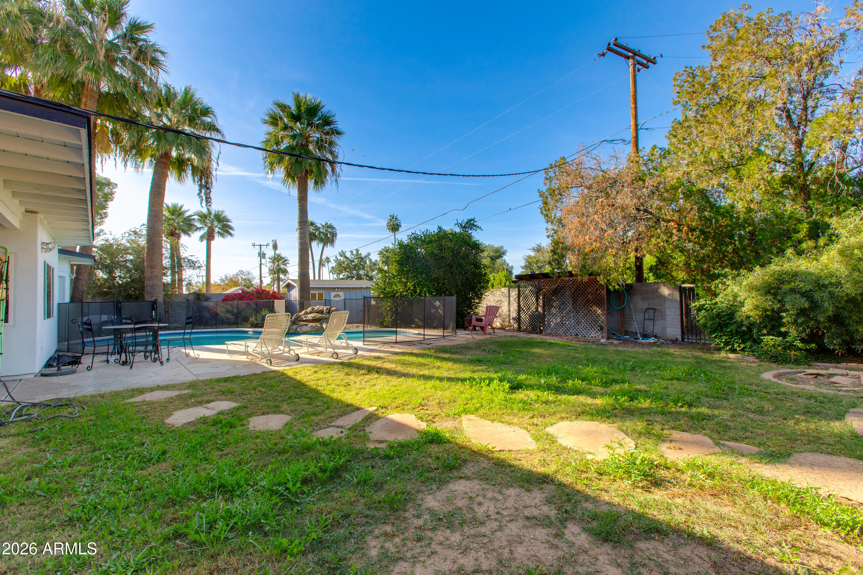 7830 North 7th Avenue Phoenix, AZ 85021 - Photo 32 of 43 a view of a house with swimming pool and sitting area