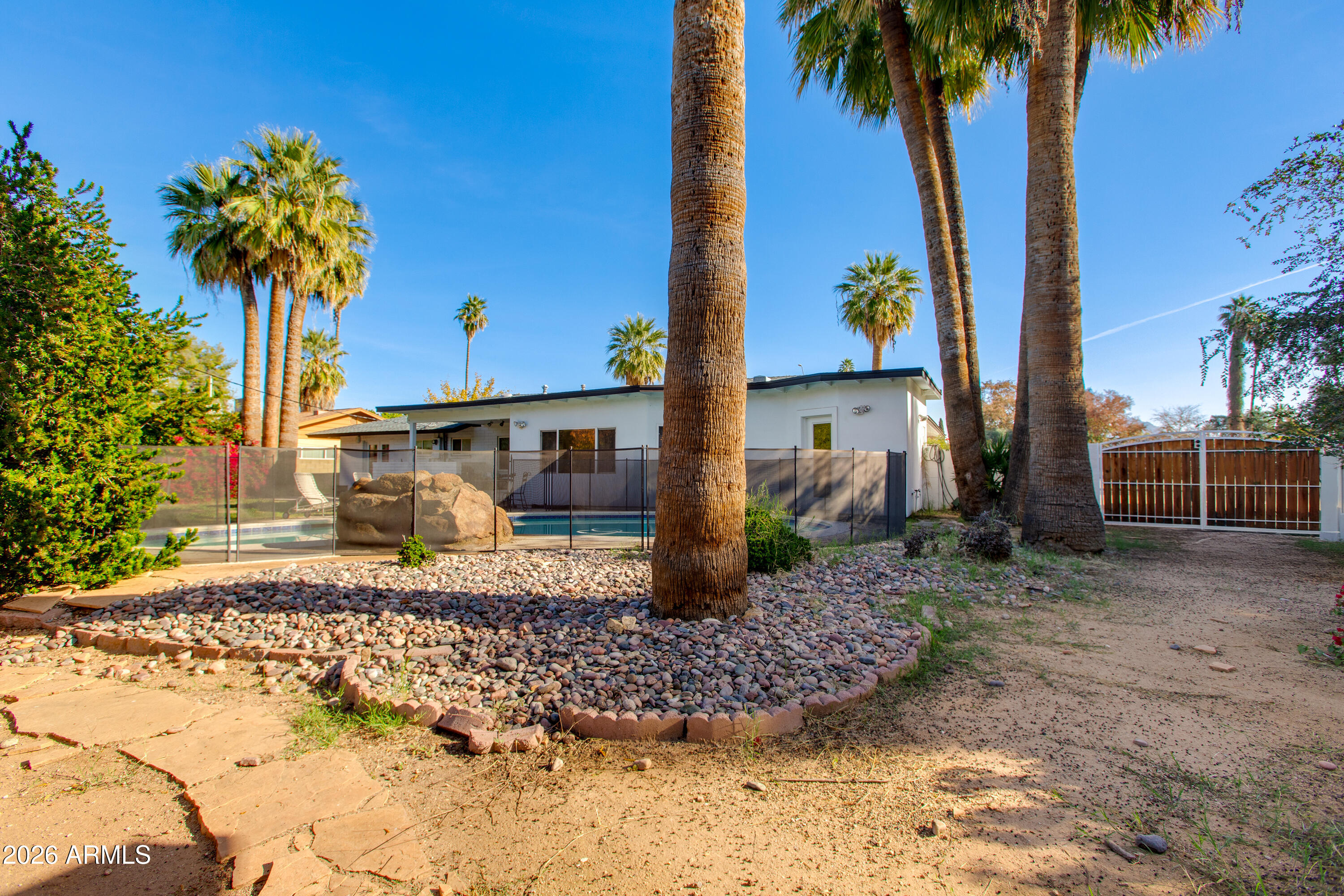 7830 North 7th Avenue Phoenix, AZ 85021 - Photo 34 of 43 a front view of a house with garden